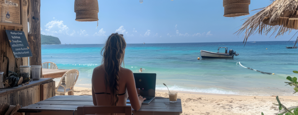 TEFL abroad bucket list moment – teacher working online from a beach café overlooking turquoise sea and boats