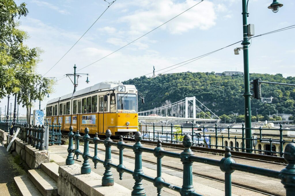 Yellow tram on a Budapest street, the city where most Hungarian TEFL jobs are based