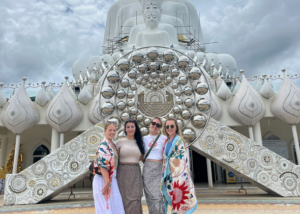 TEFL abroad bucket list – teachers visiting an ornate white temple together while exploring local culture between classes