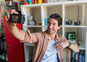 Content creator filming a vlog about TEFL and remote work from a home studio