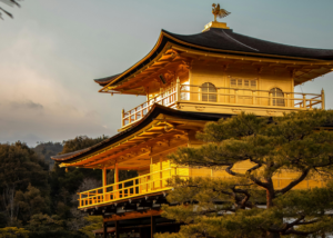 Golden Japanese temple at sunset, inspiring teachers who want to teach English in Japan without experience