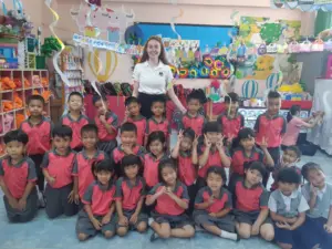TEFL teacher mentoring a colleague at a tropical Thai school on a teach English abroad programme