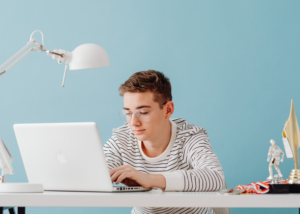 English teacher preparing for an online TEFL interview on a laptop at home