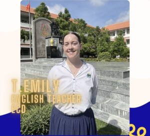 TEFL teacher speaking at a school event in Thailand alongside fellow English teachers and students.