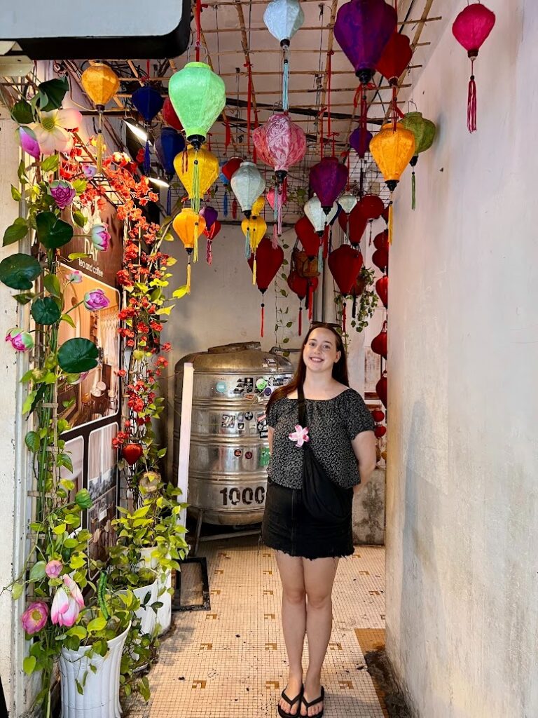 TEFL teacher exploring a colourful lantern-lined street during a weekend trip while teaching English in Thailand.