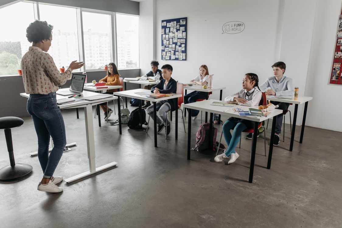 Teacher leading a small class in a private language academy, one of the main routes to teach English in Italy