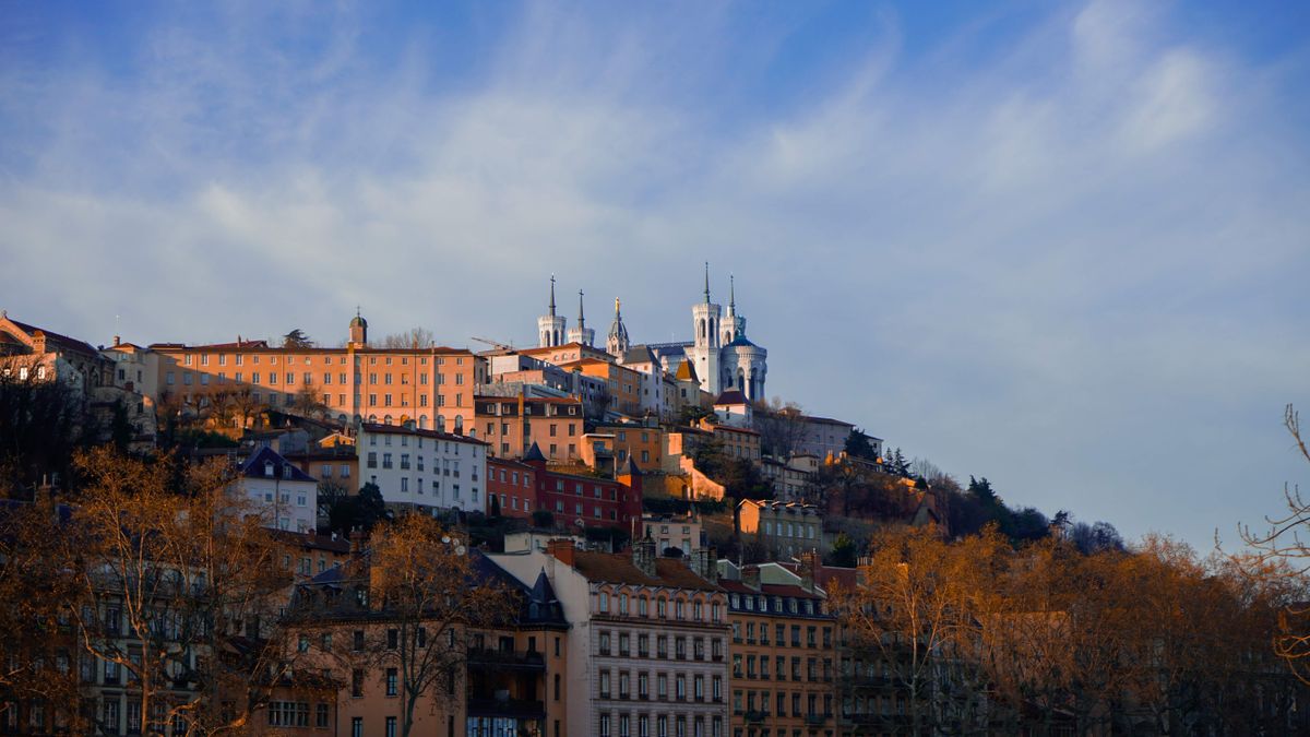 Lyon city skyline over the river, a lower cost French city for English teachers than Paris
