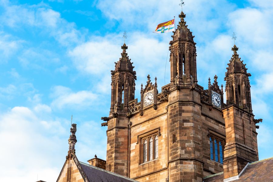 Sandstone clock tower at the University of Sydney where TESOL qualified teachers are hired